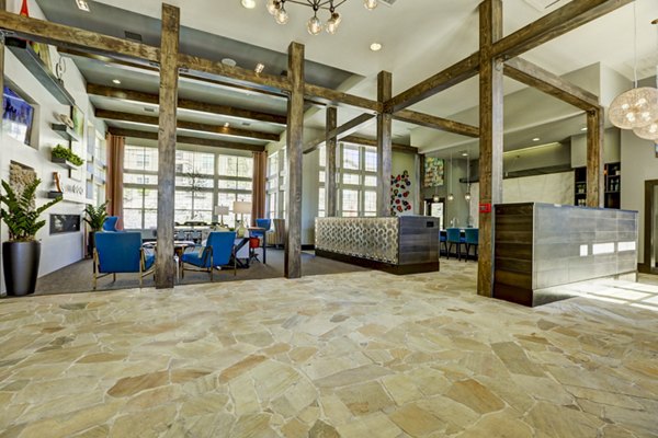 Stylish clubhouse with modern decor at Canyons at Saddle Rock Apartments, perfect for hosting events and gatherings