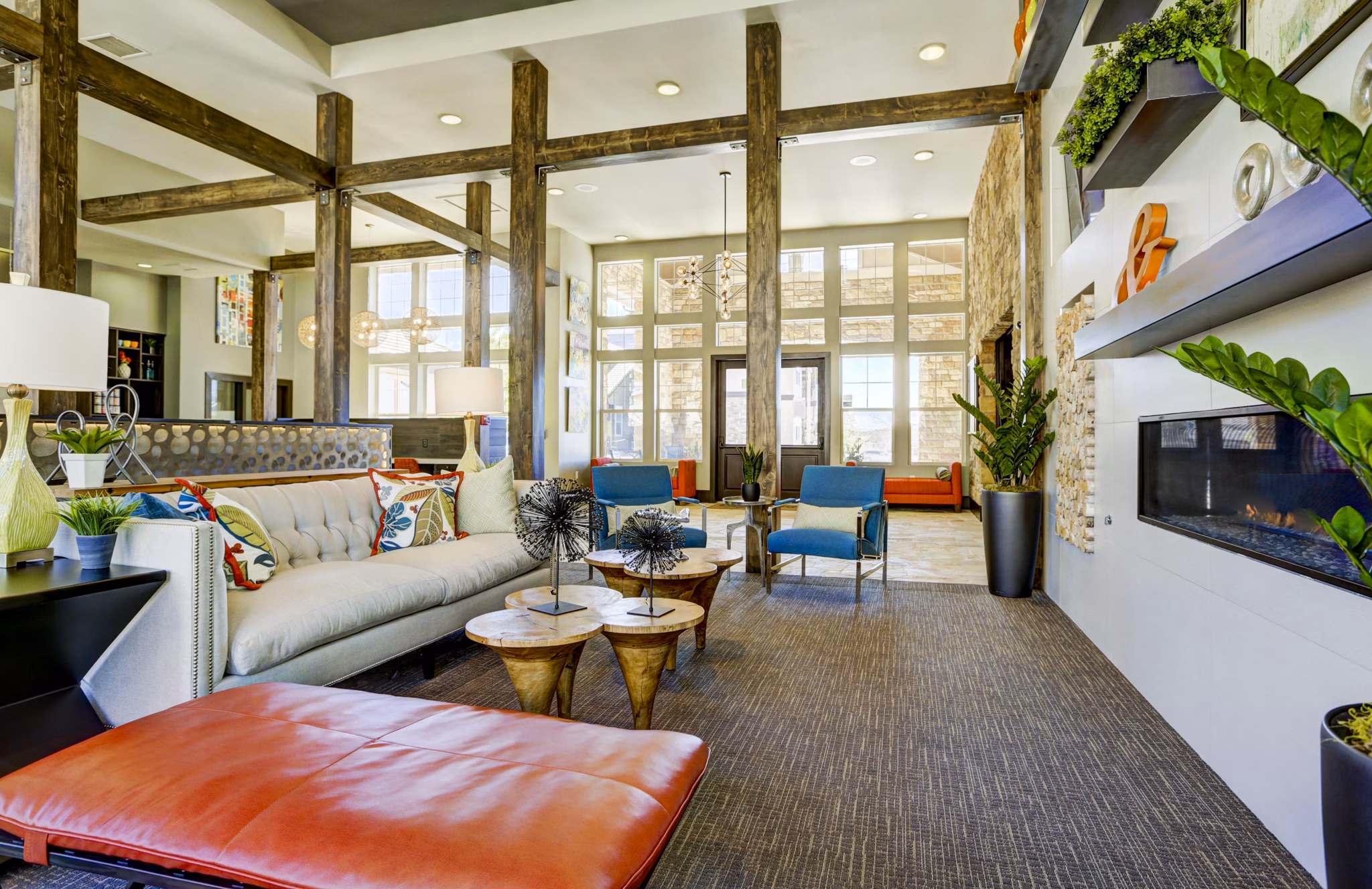 Elegant clubhouse with modern seating and decor at Canyons at Saddle Rock Apartments