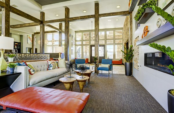 Elegant clubhouse with modern seating and decor at Canyons at Saddle Rock Apartments