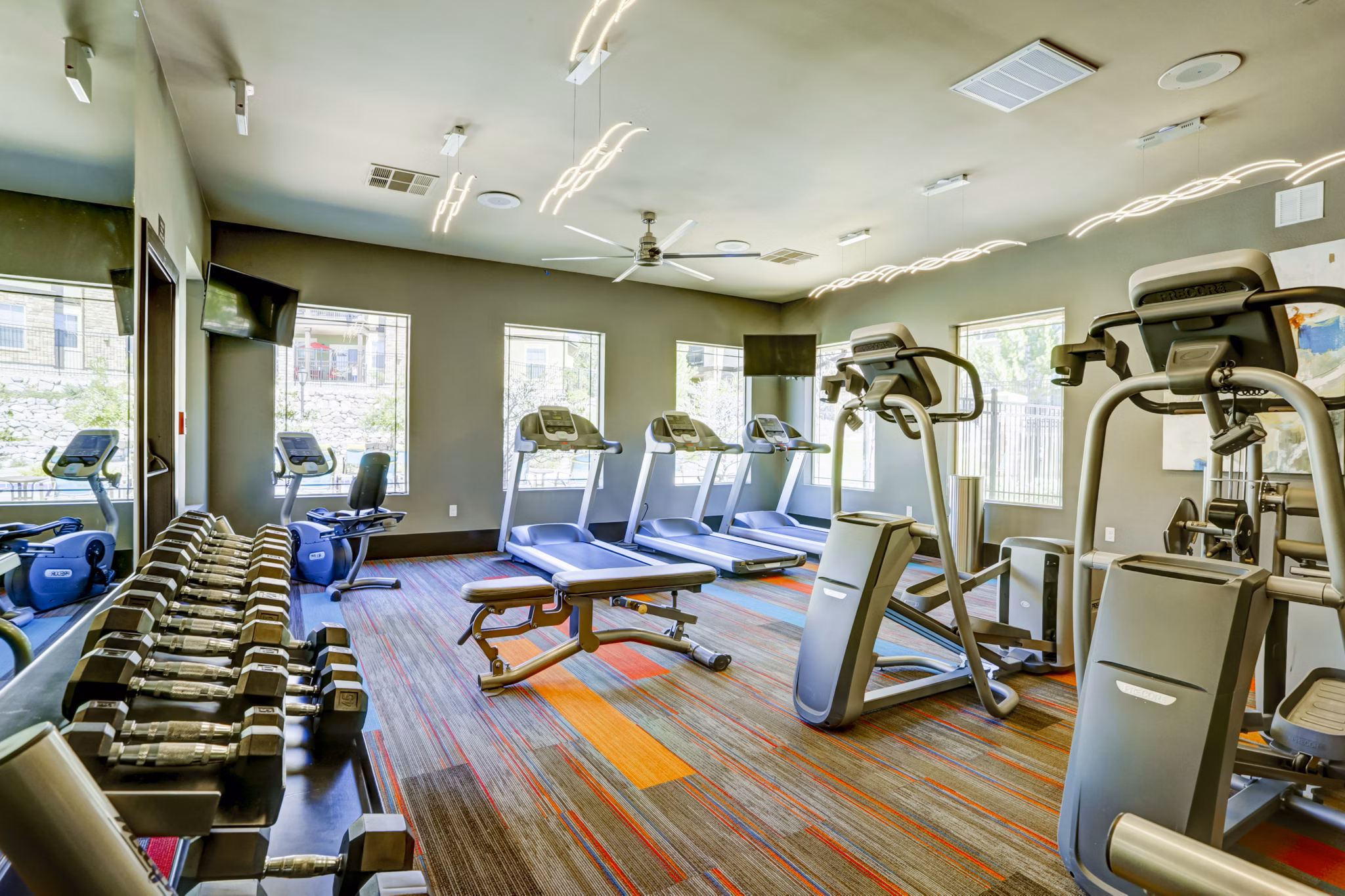 Fitness center featuring state-of-the-art equipment at Canyons at Saddle Rock Apartments