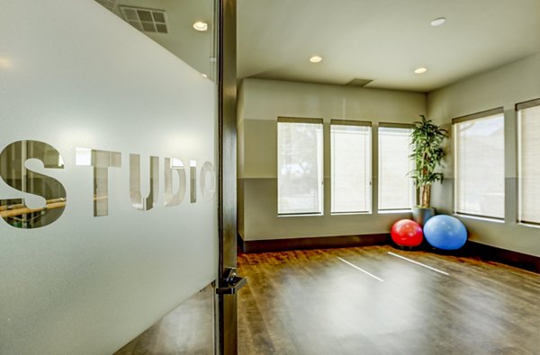 Bright yoga/spin studio with open layout at Canyons at Saddle Rock Apartments