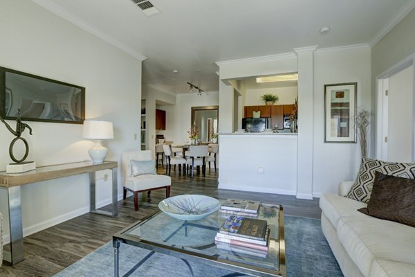 Spacious living room with modern decor in Canyons at Saddle Rock Apartments