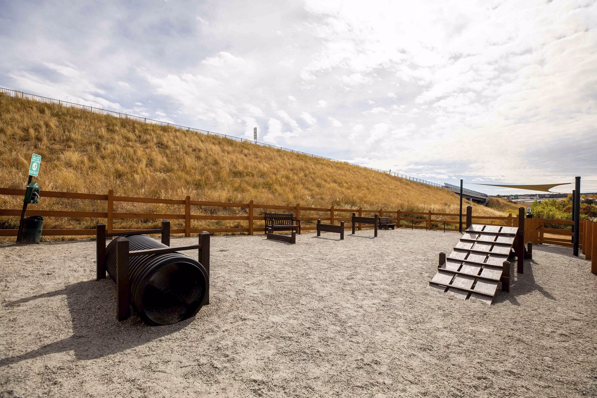 Dog park with agility equipment at Canyons at Saddle Rock Apartments
