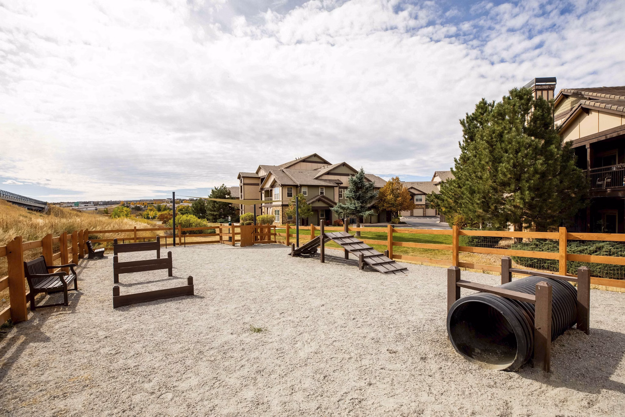 Dog park with agility course at Canyons at Saddle Rock Apartments in Aurora