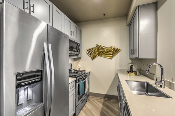 Kitchen at at Veda Apartments
