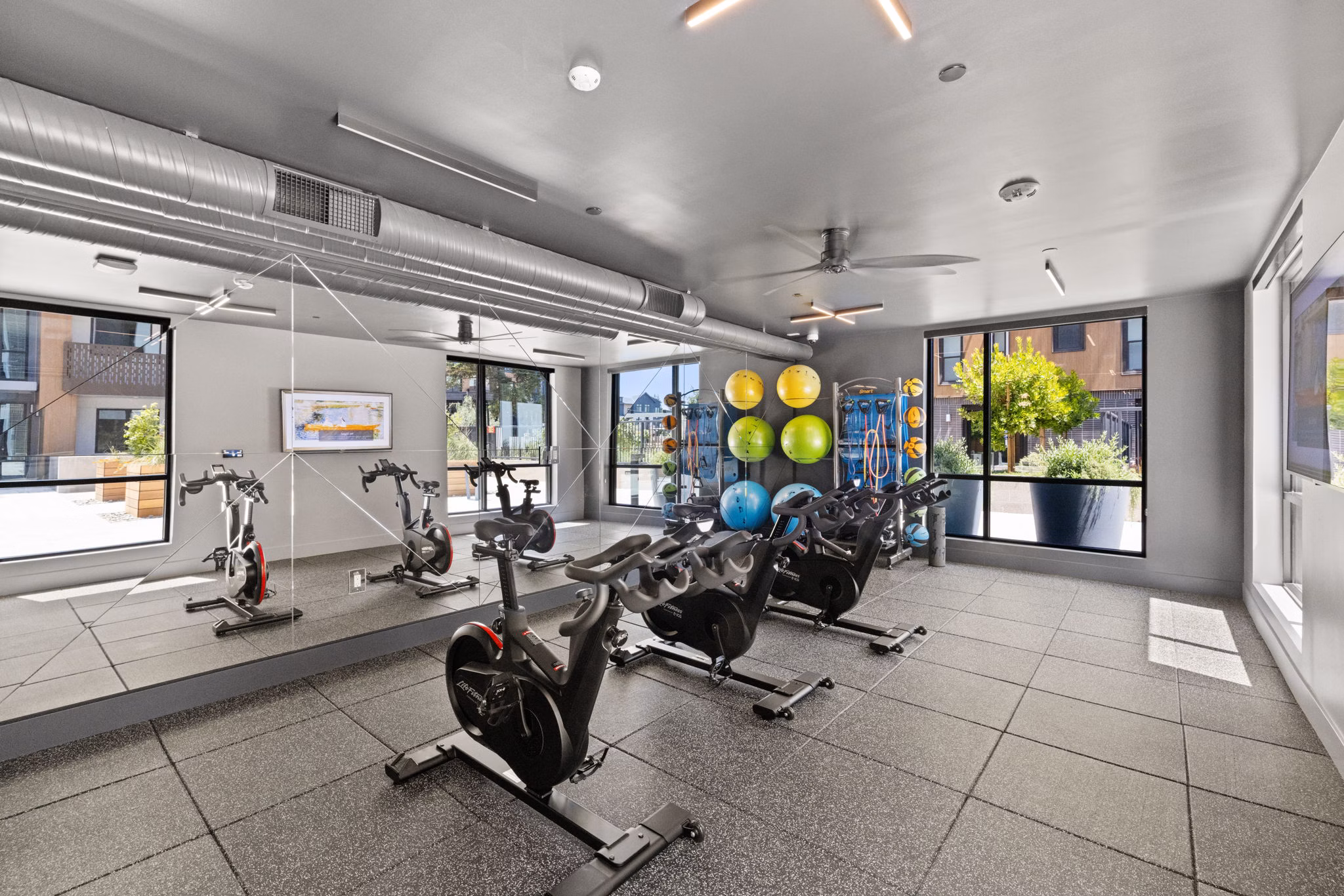 fitness center at Sevens Apartments