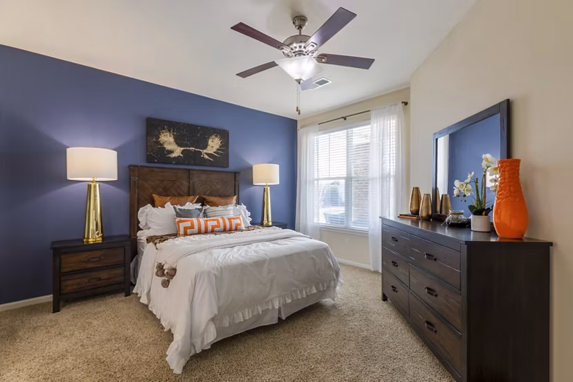 Stylish bedroom with contemporary decor at Waterford at Southlands Apartments, a luxury Greystar community