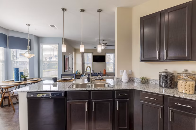 Modern kitchen with stainless steel appliances at Waterford at Southlands Apartments