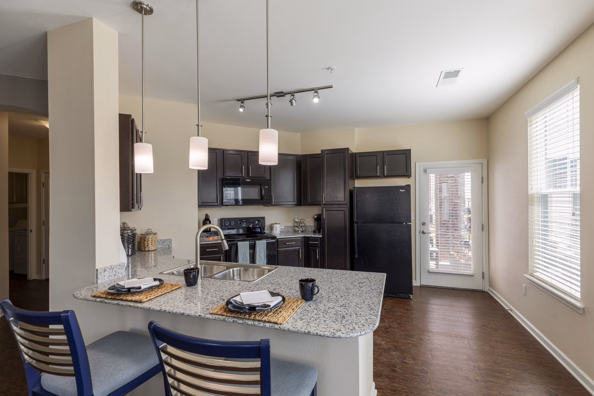 Modern kitchen with stainless steel appliances at Waterford at Southlands Apartments