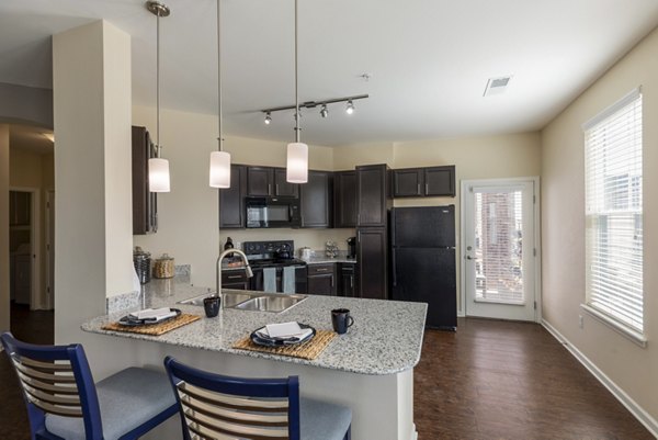 Modern kitchen with stainless steel appliances at Waterford at Southlands Apartments