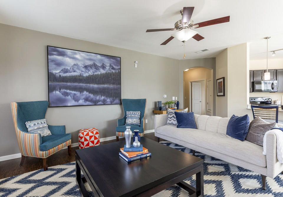Spacious living room with modern decor and large windows at Waterford at Southlands luxury apartments