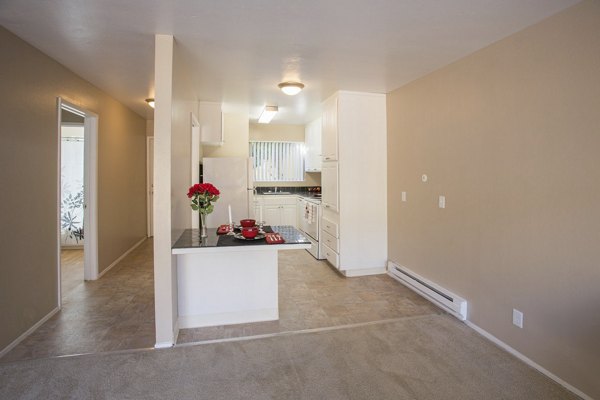 Modern kitchen featuring stainless steel appliances in Woodland Park Apartments, a luxurious Greystar property