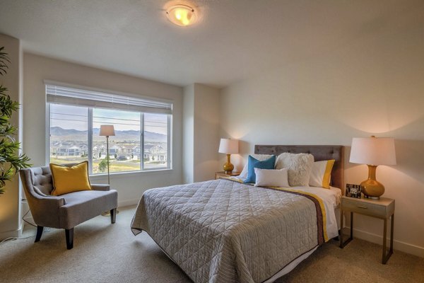Bedroom with modern decor and natural light at Rockwell Village Apartments