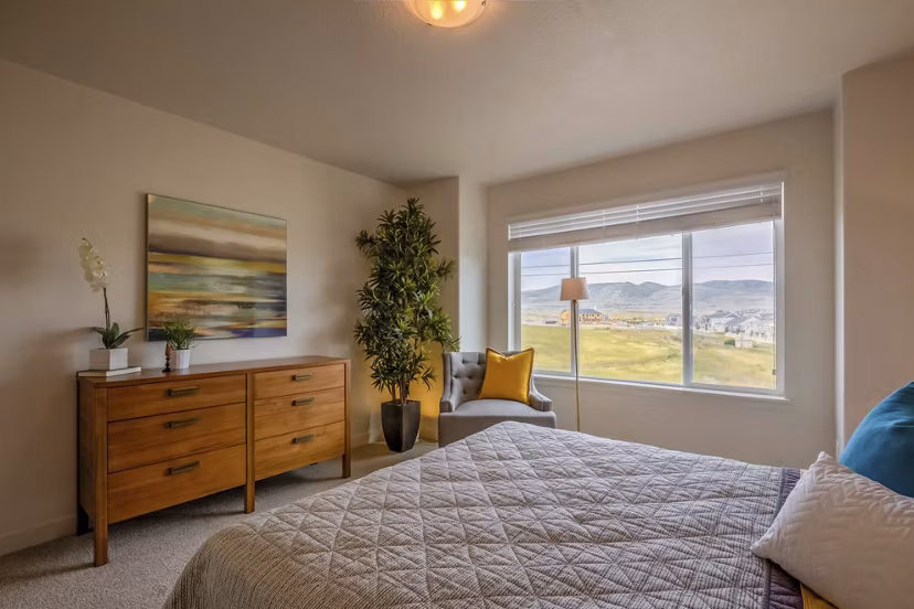 Cozy bedroom with modern decor in Rockwell Village Apartments