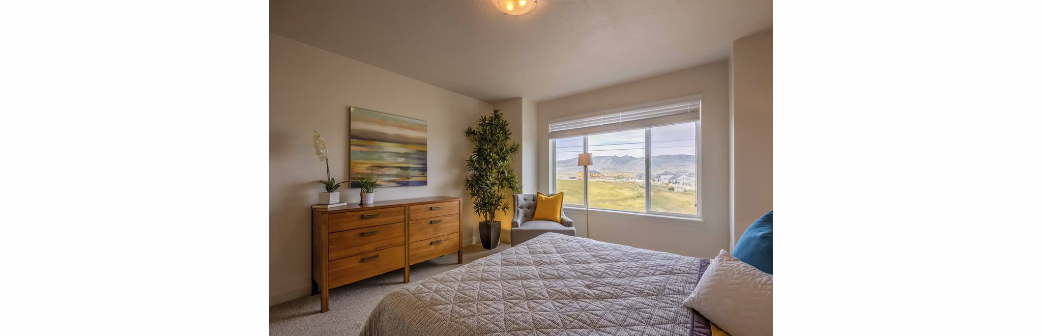 Cozy bedroom with modern decor in Rockwell Village Apartments
