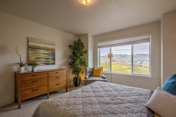 Cozy bedroom with modern decor in Rockwell Village Apartments