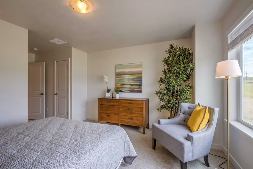 Bedroom featuring modern design elements at Rockwell Village Apartments