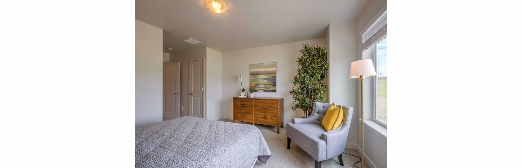 Bedroom featuring modern design elements at Rockwell Village Apartments