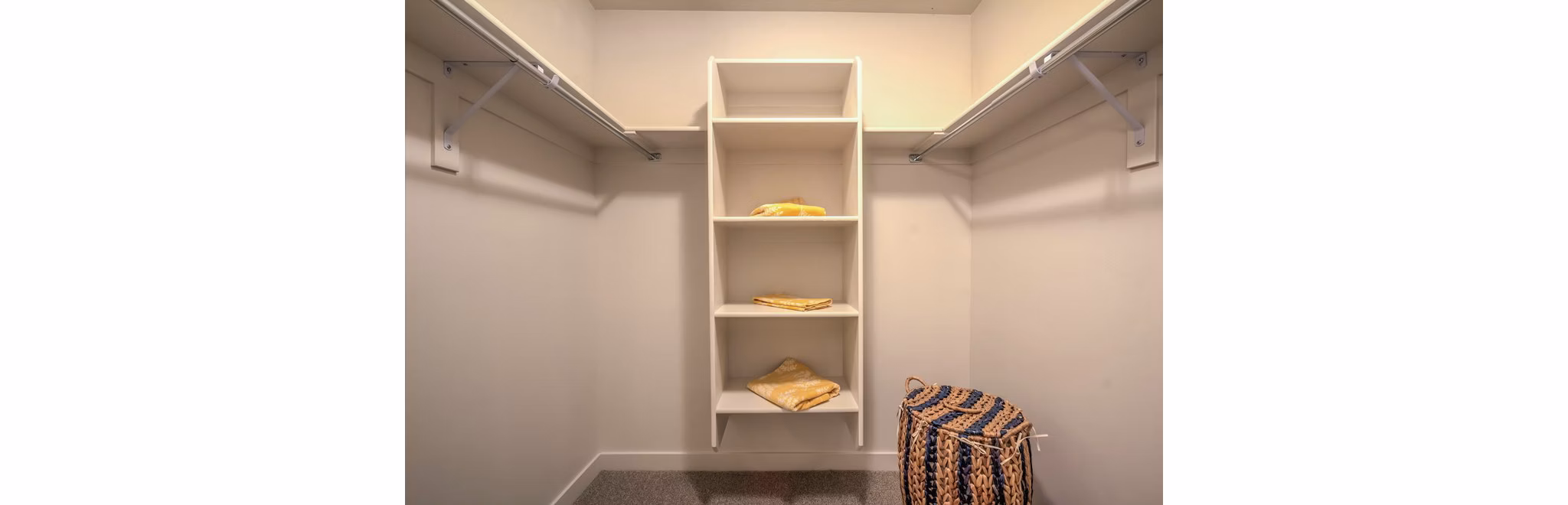 Organized closet space with custom shelving in Rockwell Village Apartments