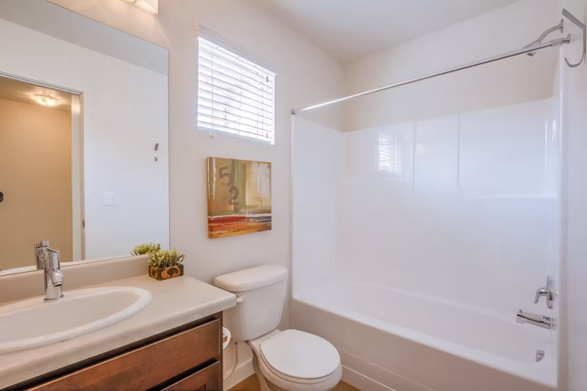 Spa-like bathroom with sleek fixtures at Rockwell Village Apartments, showcasing luxury design and high-end finishes