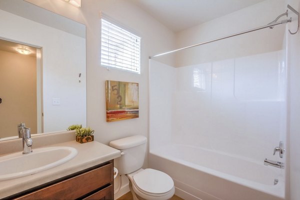 Spa-like bathroom with sleek fixtures at Rockwell Village Apartments, showcasing luxury design and high-end finishes