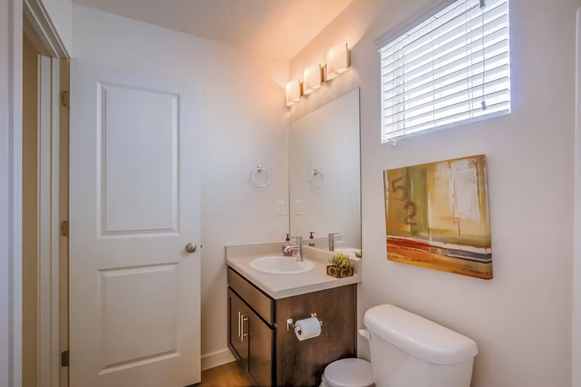 Modern bathroom with sleek fixtures at Rockwell Village Apartments