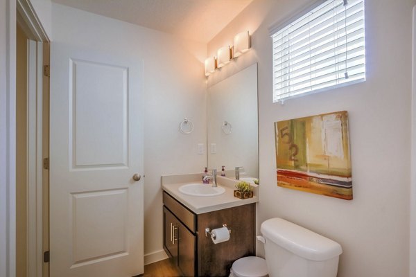 Modern bathroom with sleek fixtures at Rockwell Village Apartments