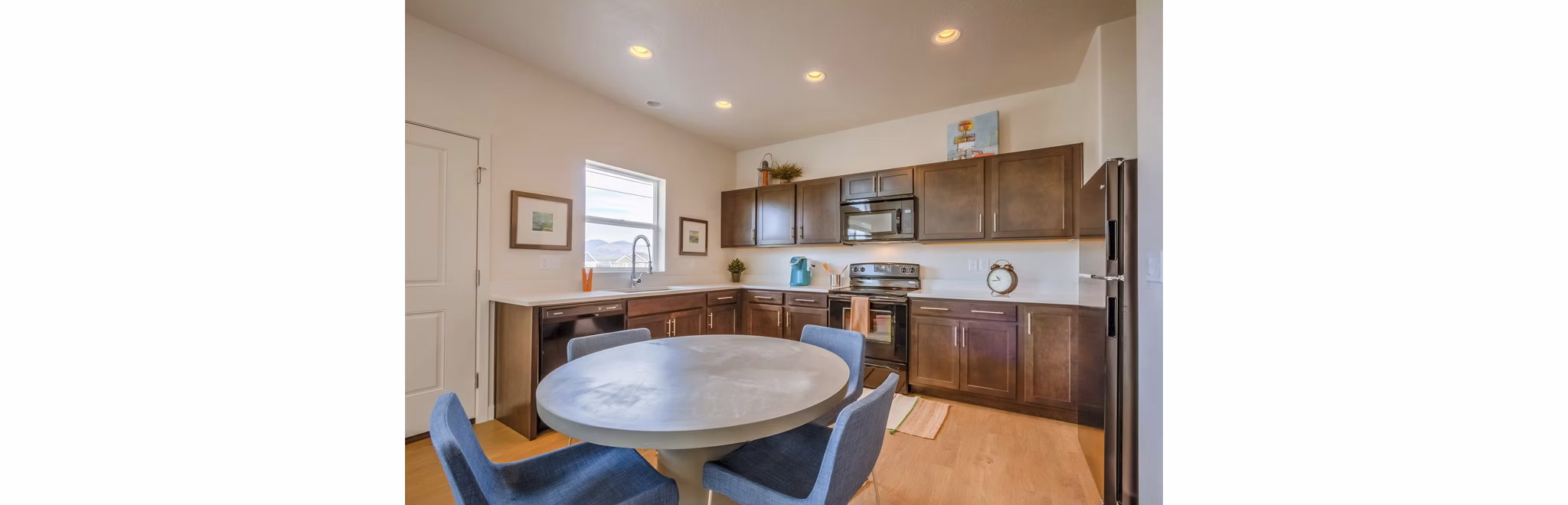 Stylish dining area with modern furniture in Rockwell Village Apartments