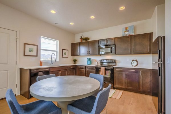 Stylish dining area with modern furniture in Rockwell Village Apartments