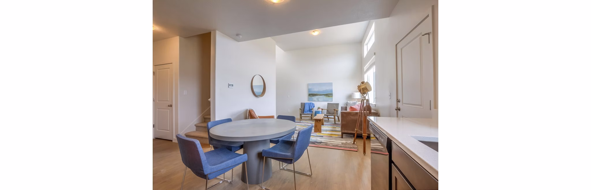 Dining area with modern furnishings at Rockwell Village Apartments