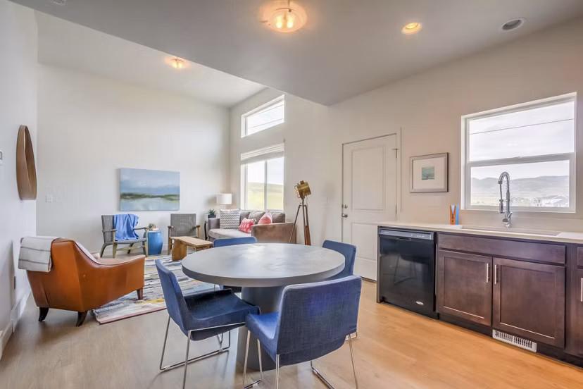 Dining area with modern furnishings in Rockwell Village Apartments luxury community