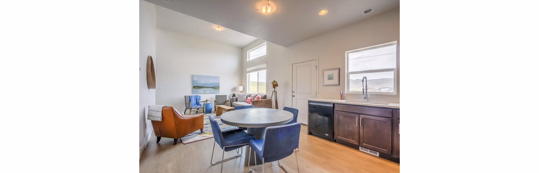Dining area with modern furnishings in Rockwell Village Apartments luxury community