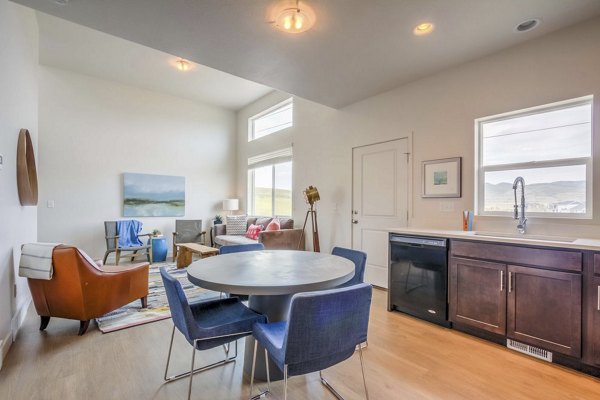 Dining area with modern furnishings in Rockwell Village Apartments luxury community