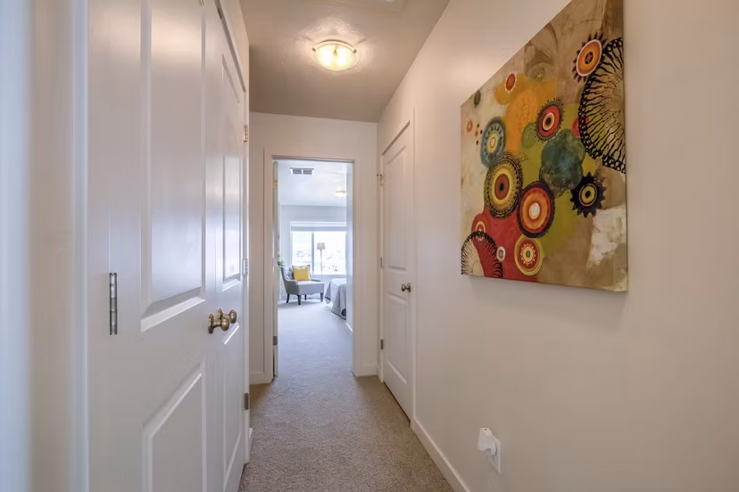 Modern hallway with sleek lighting fixtures at Rockwell Village Apartments