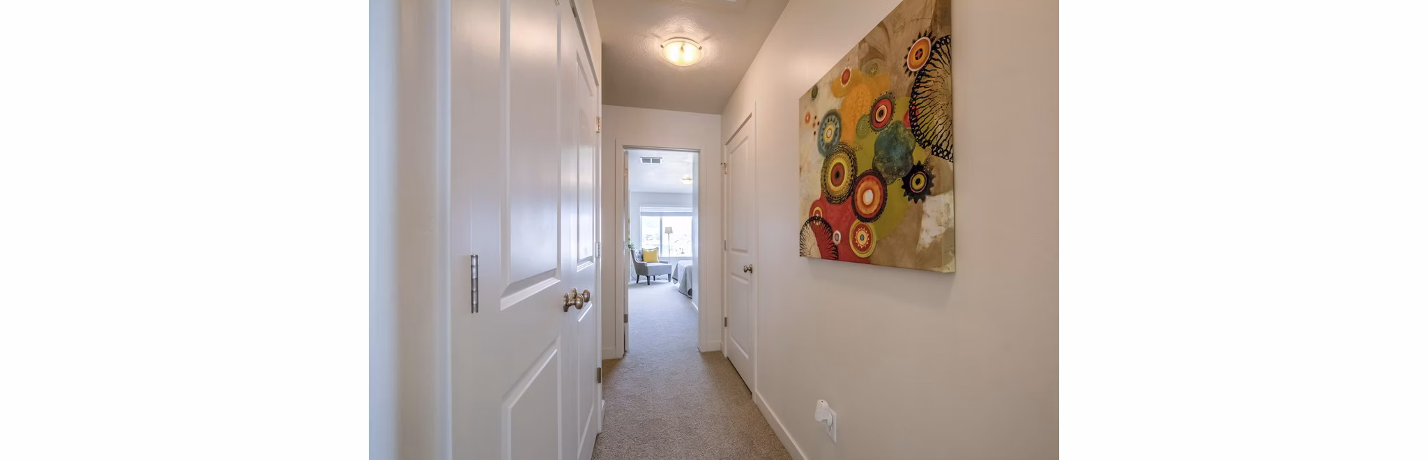 Modern hallway with sleek lighting fixtures at Rockwell Village Apartments