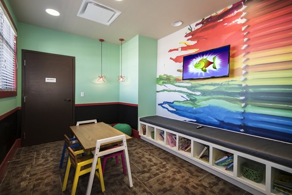 Children's playground at Waterford on Mainstreet Apartments, a family-friendly community with modern amenities and lush green spaces