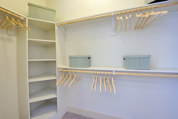 Walk-in closet with built-in shelving in Broadstone Woodmill Creek Apartments