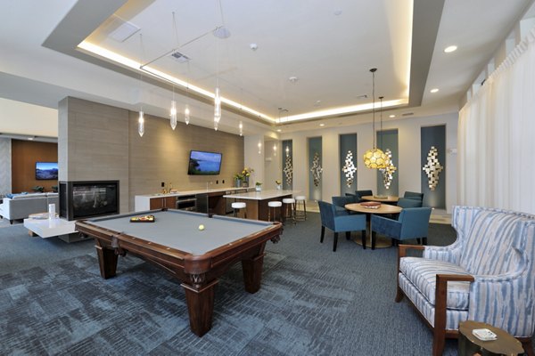 Clubhouse featuring modern design and ample seating at Broadstone Woodmill Creek Apartments
