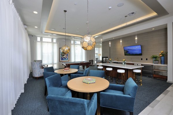 Clubhouse at Broadstone Woodmill Creek: Modern lounge with cozy seating and entertainment area in luxury community apartments