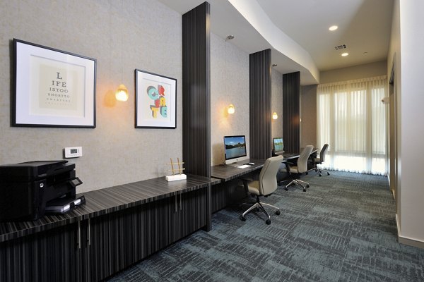 Business center with workstations and modern decor at Broadstone Woodmill Creek Apartments