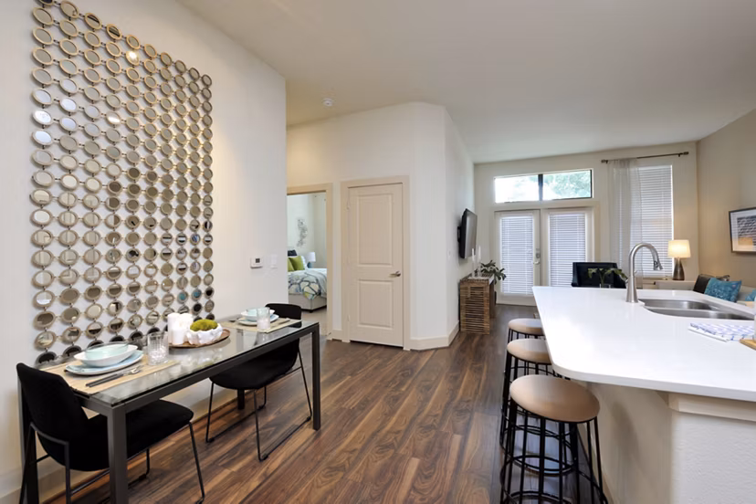 Dining area featuring modern furnishings and elegant lighting at Broadstone Woodmill Creek Apartments