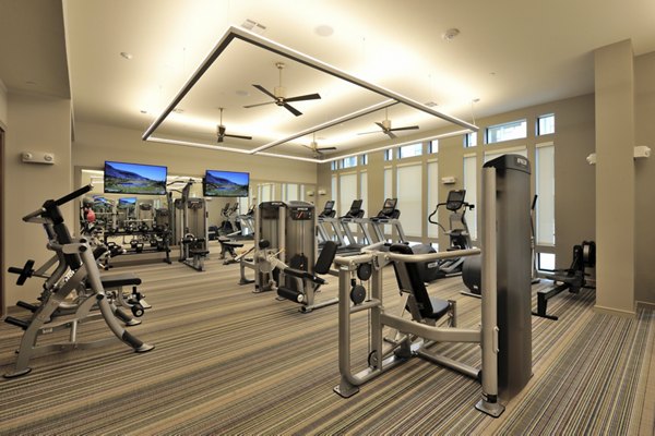 State-of-the-art fitness center with cardio equipment at Broadstone Woodmill Creek Apartments in The Woodlands