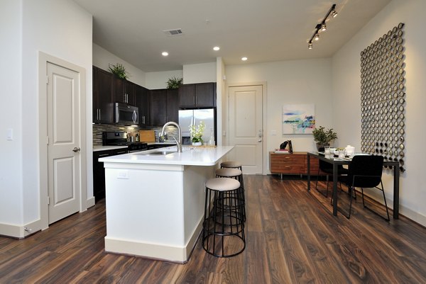 Modern kitchen with stainless steel appliances at Broadstone Woodmill Creek Apartments