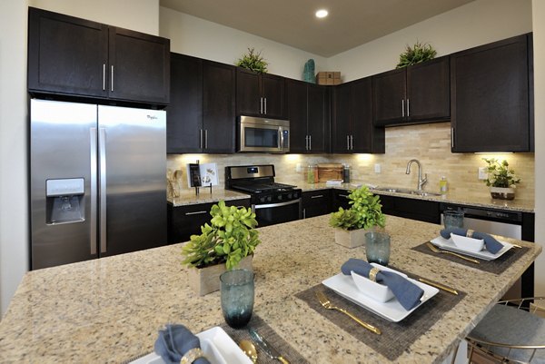 Broadstone Woodmill Creek: Modern kitchen with stainless steel appliances and granite countertops in luxury apartments