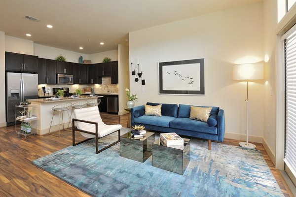 Spacious living room with modern decor at Broadstone Woodmill Creek Apartments