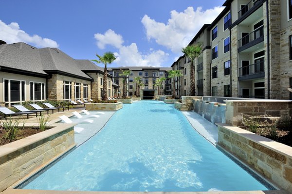 Relaxing poolside haven at Broadstone Woodmill Creek Apartments