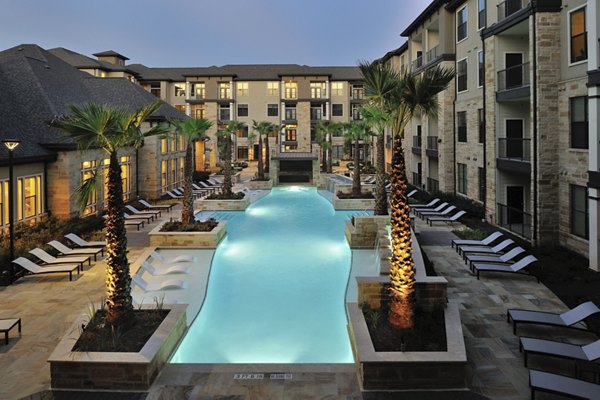 Resort-style pool with loungers at Broadstone Woodmill Creek Apartments offering luxury living near the Woodlands