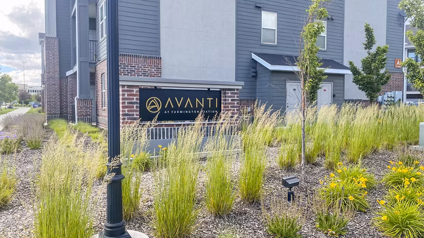 Signage for Avanti at Farmington Station Apartments showcasing modern design and welcoming entrance for residents and visitors