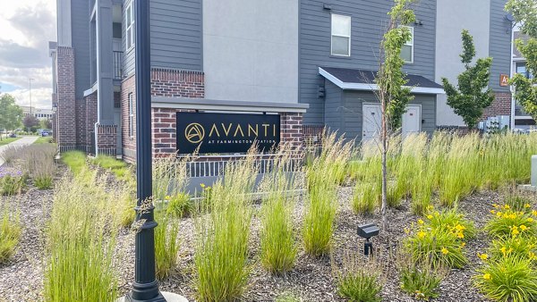 Signage for Avanti at Farmington Station Apartments showcasing modern design and welcoming entrance for residents and visitors