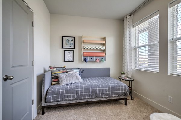 Cozy bedroom with modern decor at Avanti at Farmington Station Apartments